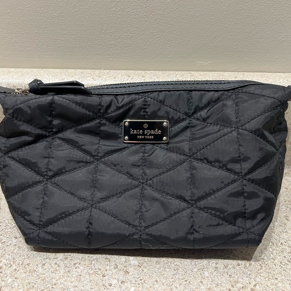 Very gently used Kate Spade cosmetic bag in black.